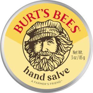 Burt’s Bees Hand Salve tin container with yellow label and farmer illustration, 85g.