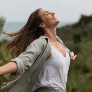 Happy woman enjoying freedom and comfort representing urinary wellness and relief