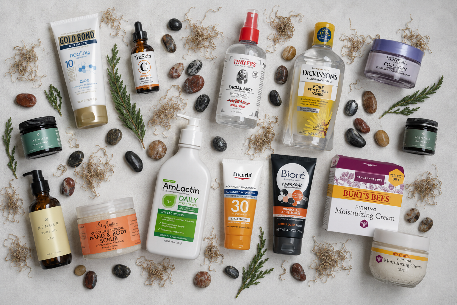 A flat-lay arrangement of the best skincare products for dry skin, including moisturizers, serums, toners, and scrubs, displayed on a textured surface with decorative stones.