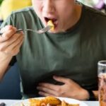 Signs of an unhealthy gut shown through fresh, gut-friendly whole foods